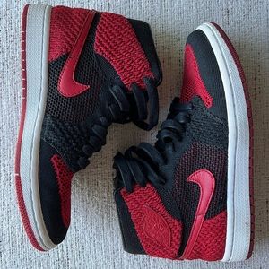 Jordan 1 Retro High Flyknit Bred (GS) fits women’s size 7